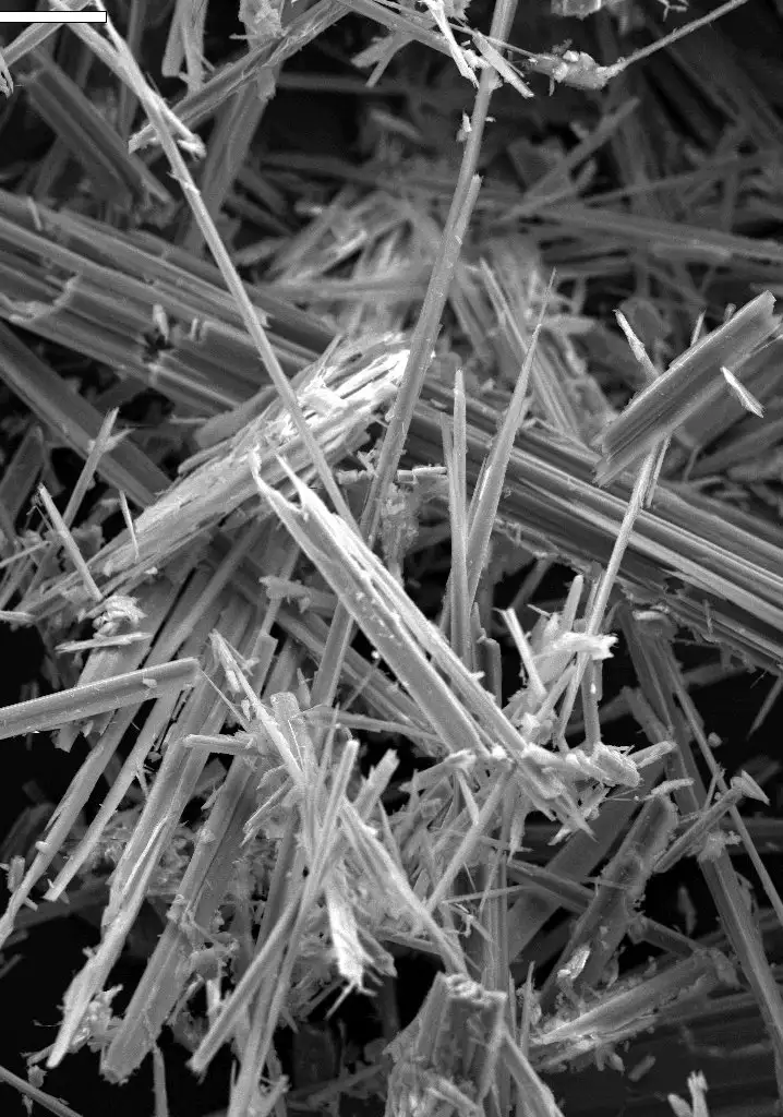 White asbestos fibers against dark background